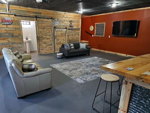 44811 County Highway 14, Perham, MN 56573 - living room featuring a barn door, sink, and wooden walls