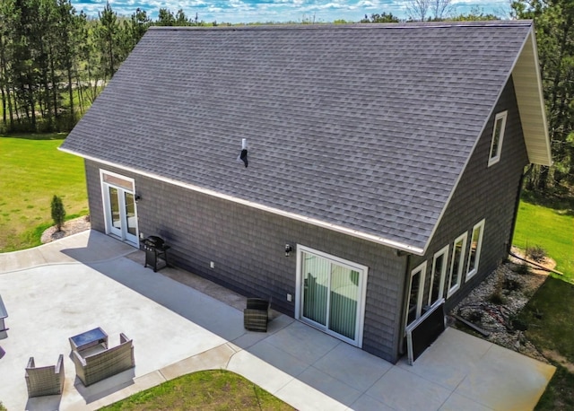44811 County Highway 14, Perham, MN 56573 - rear view of property featuring a lawn, a patio area, and french doors
