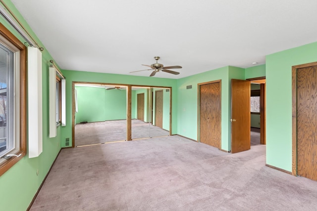 interior space featuring ceiling fan