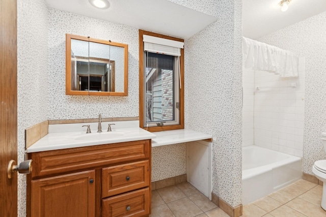 bathroom featuring tile patterned floors, vanity, and toilet