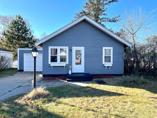 view of front facade with a garage and a front yard