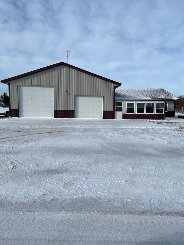 view of snow covered garage