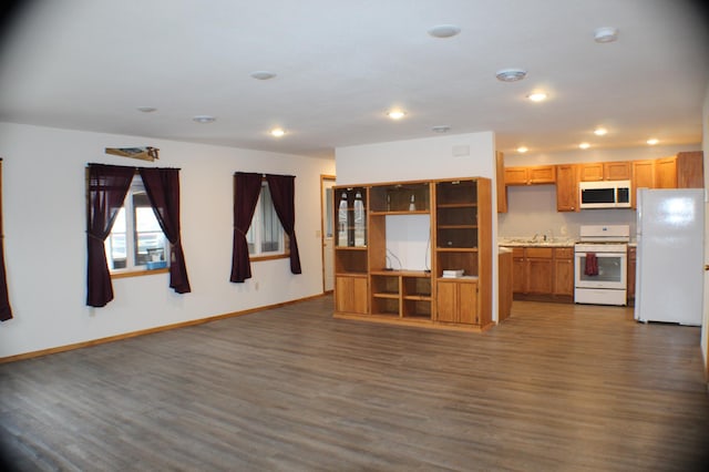 unfurnished living room with dark hardwood / wood-style floors