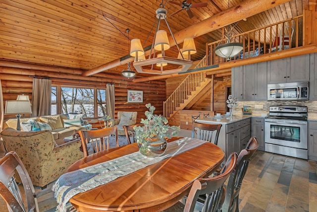 dining area with wood ceiling, beamed ceiling, high vaulted ceiling, and stairs