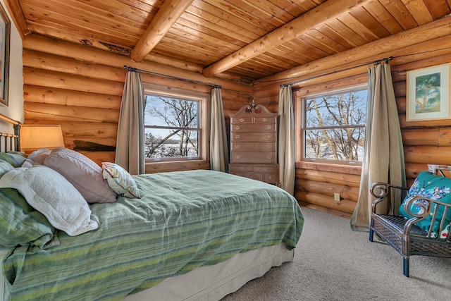 carpeted bedroom with beamed ceiling, multiple windows, and wooden ceiling