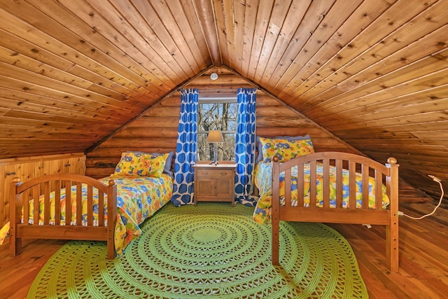 unfurnished bedroom featuring hardwood / wood-style floors, vaulted ceiling, wooden ceiling, and log walls