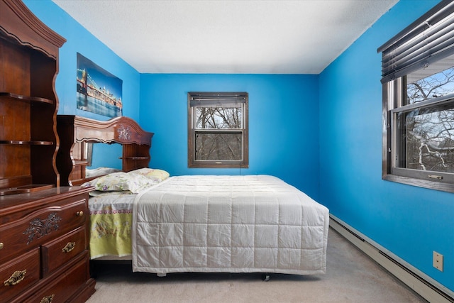 bedroom featuring a baseboard radiator and light carpet