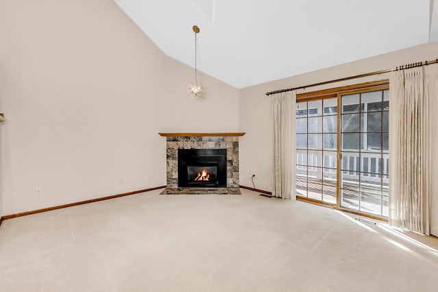 unfurnished living room featuring carpet flooring and high vaulted ceiling