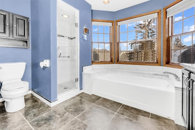 bathroom featuring tile patterned flooring, shower with separate bathtub, toilet, and plenty of natural light