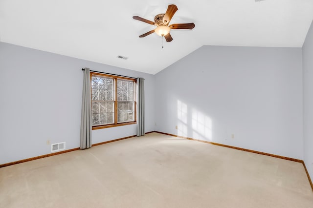 unfurnished room featuring light carpet, ceiling fan, and lofted ceiling