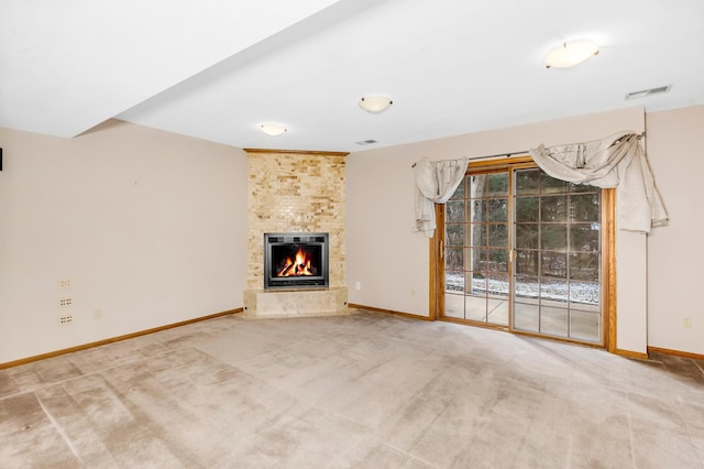 unfurnished living room featuring a fireplace and carpet floors