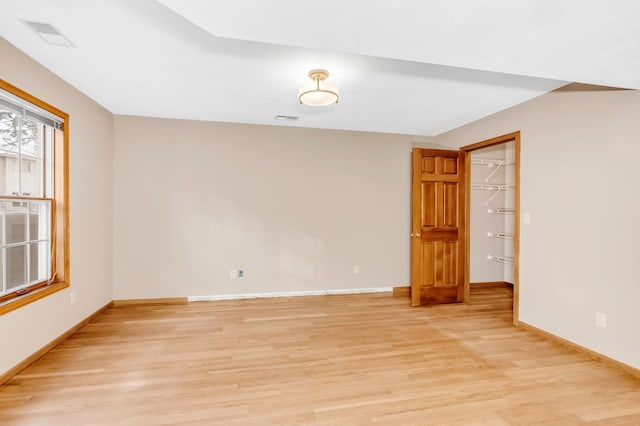 spare room featuring light hardwood / wood-style floors