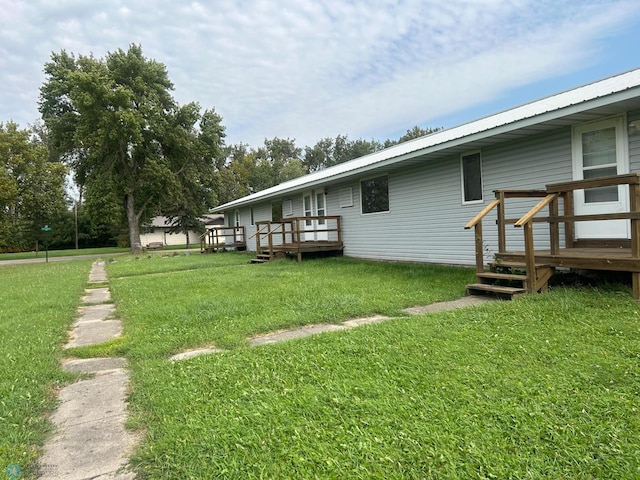 view of yard featuring a wooden deck