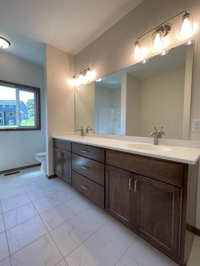 bathroom with vanity and toilet