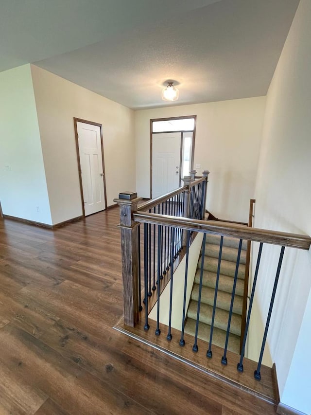 staircase featuring hardwood / wood-style floors