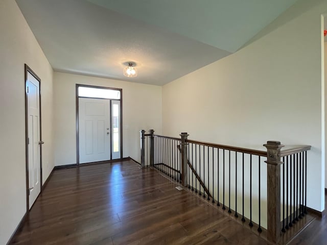 foyer featuring dark wood-type flooring