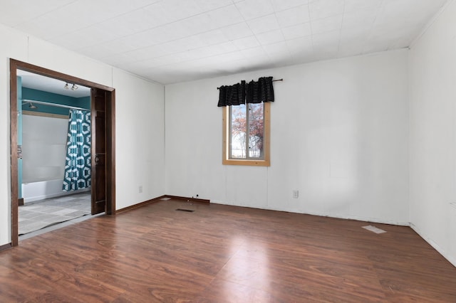 empty room with dark hardwood / wood-style floors