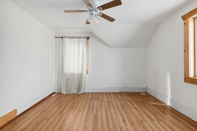 bonus room with ceiling fan, light hardwood / wood-style floors, and lofted ceiling