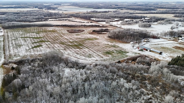 snowy aerial view featuring a rural view