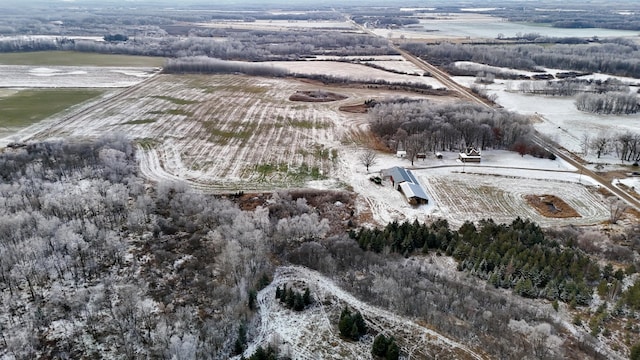 snowy aerial view featuring a rural view