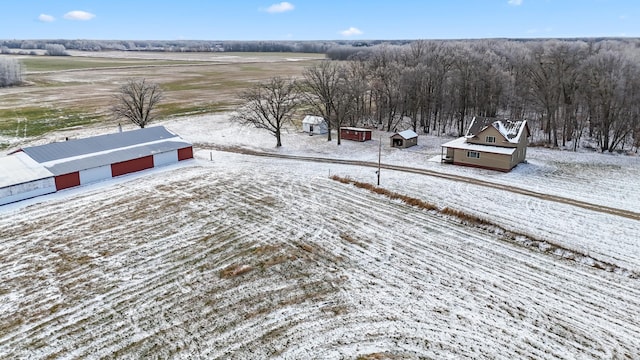 snowy aerial view featuring a rural view