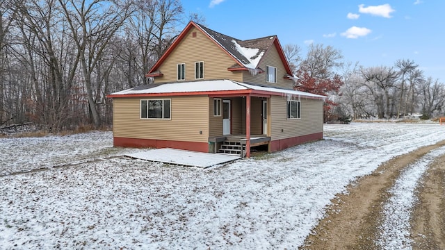 view of snow covered house