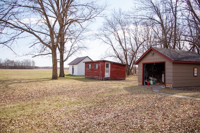 61684 260th St, Hewitt, MN 56453 - view of yard with a garage and an outbuilding