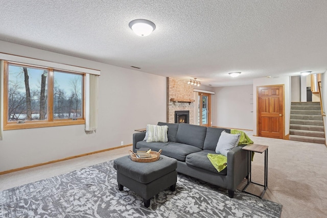 carpeted living room with a brick fireplace and a textured ceiling