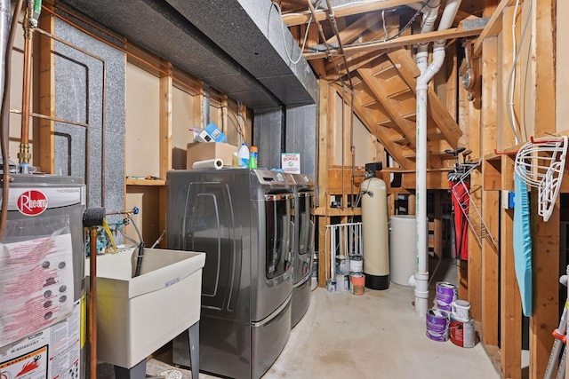 basement featuring separate washer and dryer, sink, and gas water heater