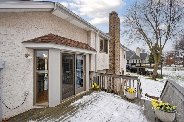 view of snow covered deck