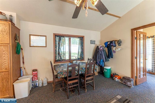 dining area with ceiling fan, lofted ceiling, and dark colored carpet