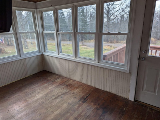 unfurnished sunroom featuring a wealth of natural light