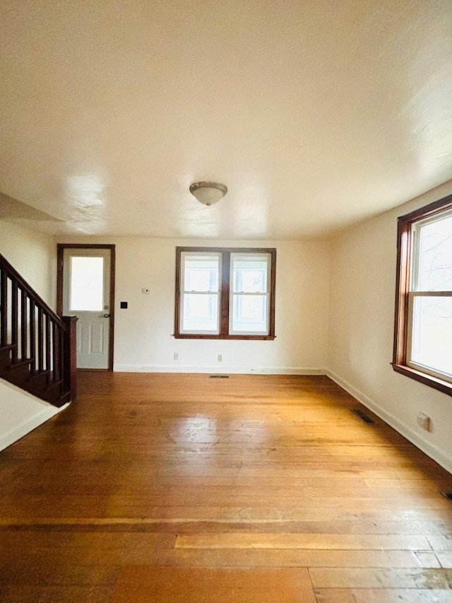 unfurnished living room featuring light wood-type flooring