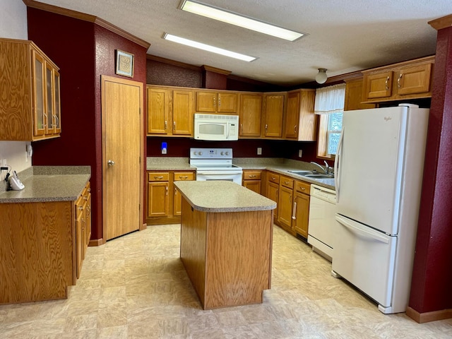 kitchen featuring a kitchen island, white appliances, a textured ceiling, and vaulted ceiling