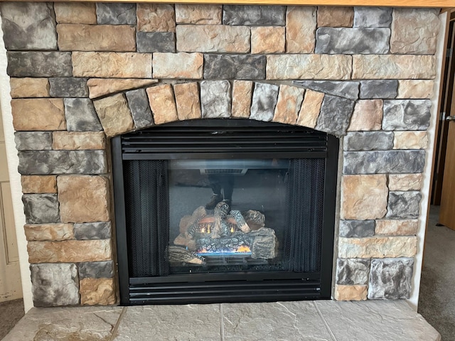 details with a stone fireplace