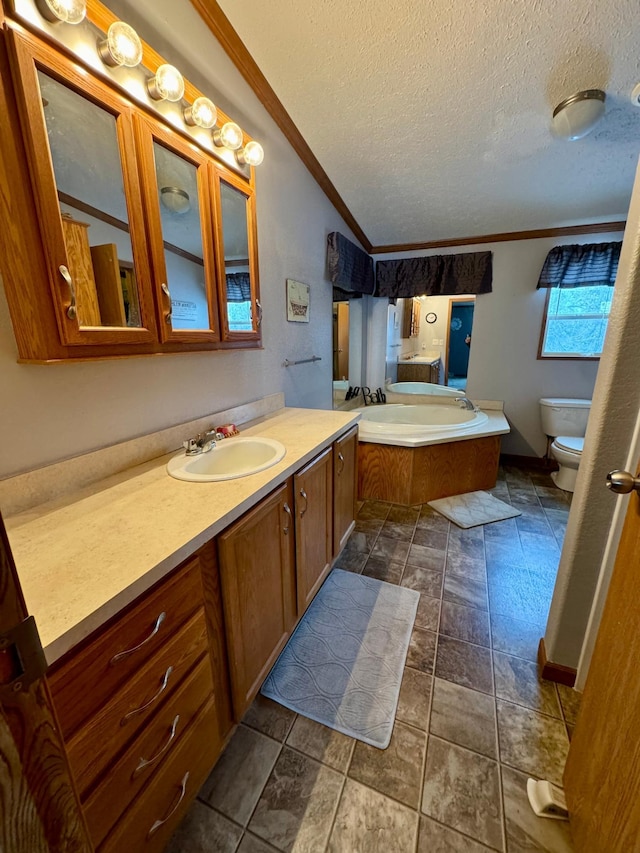 bathroom with a bath, crown molding, lofted ceiling, a textured ceiling, and toilet