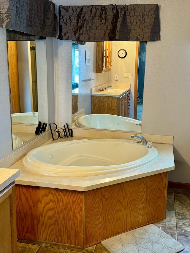 bathroom featuring a washtub and vanity