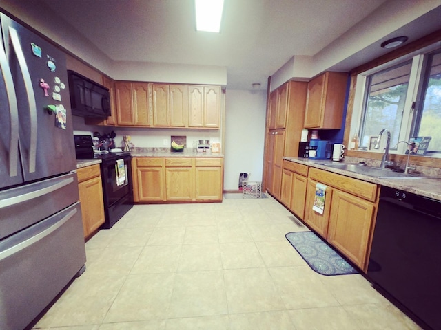 kitchen with sink and black appliances