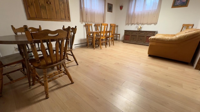 dining area with light hardwood / wood-style floors