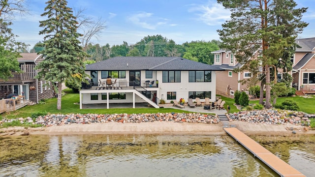 804 County Road I W, Shoreview, MN 55126 - back of property with stairway, a patio, a yard, and roof with shingles