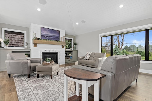 804 County Road I W, Shoreview, MN 55126 - living area with vaulted ceiling, recessed lighting, a fireplace, and light wood-style flooring