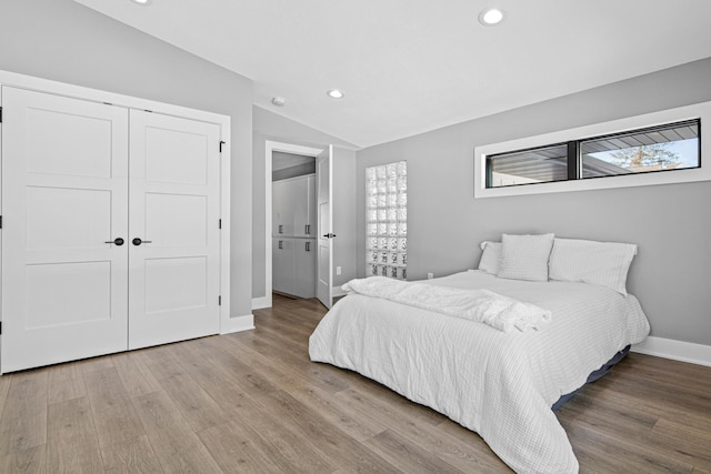 804 County Road I W, Shoreview, MN 55126 - bedroom with lofted ceiling, recessed lighting, wood finished floors, and a closet