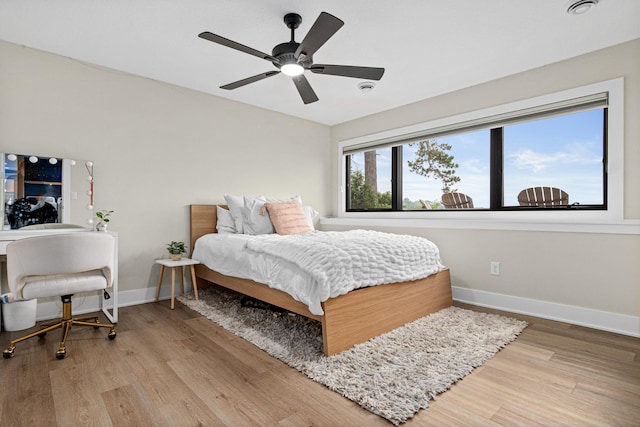 804 County Road I W, Shoreview, MN 55126 - bedroom featuring wood finished floors and a ceiling fan