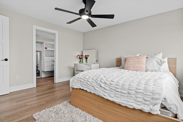 804 County Road I W, Shoreview, MN 55126 - bedroom featuring wood finished floors, a spacious closet, a closet, and ceiling fan