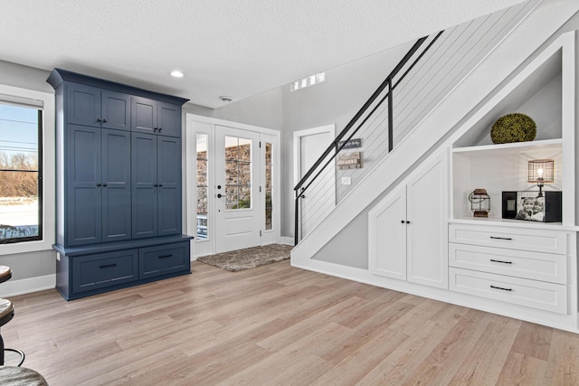 804 County Road I W, Shoreview, MN 55126 - foyer with light wood-type flooring, stairway, a textured ceiling, and recessed lighting