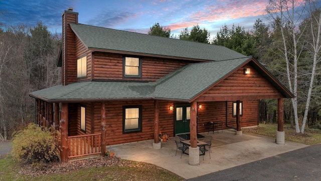 cabin with a patio area