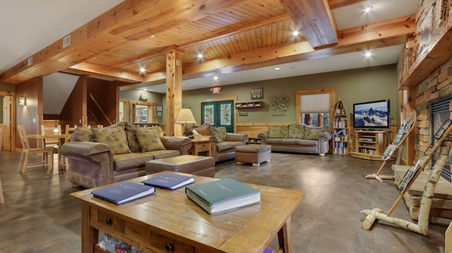 living room featuring beam ceiling, a stone fireplace, french doors, and wooden ceiling