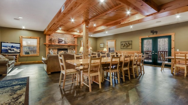 18059 County Highway Oo, Chippewa Falls, WI 54729 - dining space with beam ceiling, recessed lighting, a fireplace, and french doors