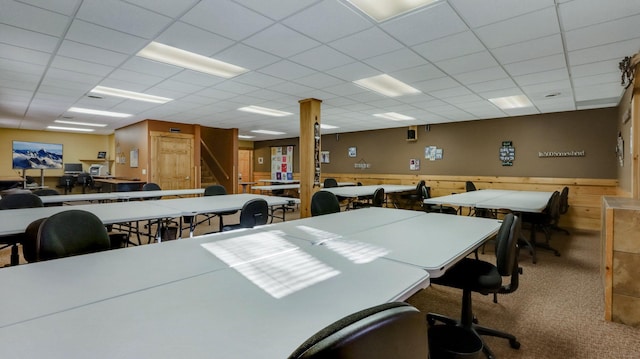 carpeted office featuring a drop ceiling