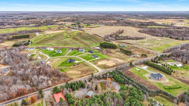 birds eye view of property with a rural view